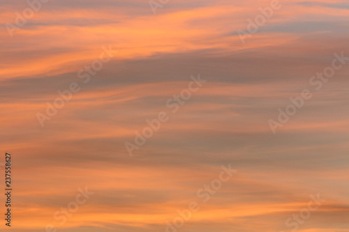 Colorful bright clouds in sunset time. Like brush strokes. © Opalev