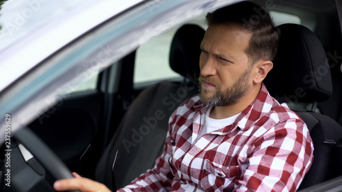 Car driver waiting in traffic jam, eyesight disease, health weakness, care