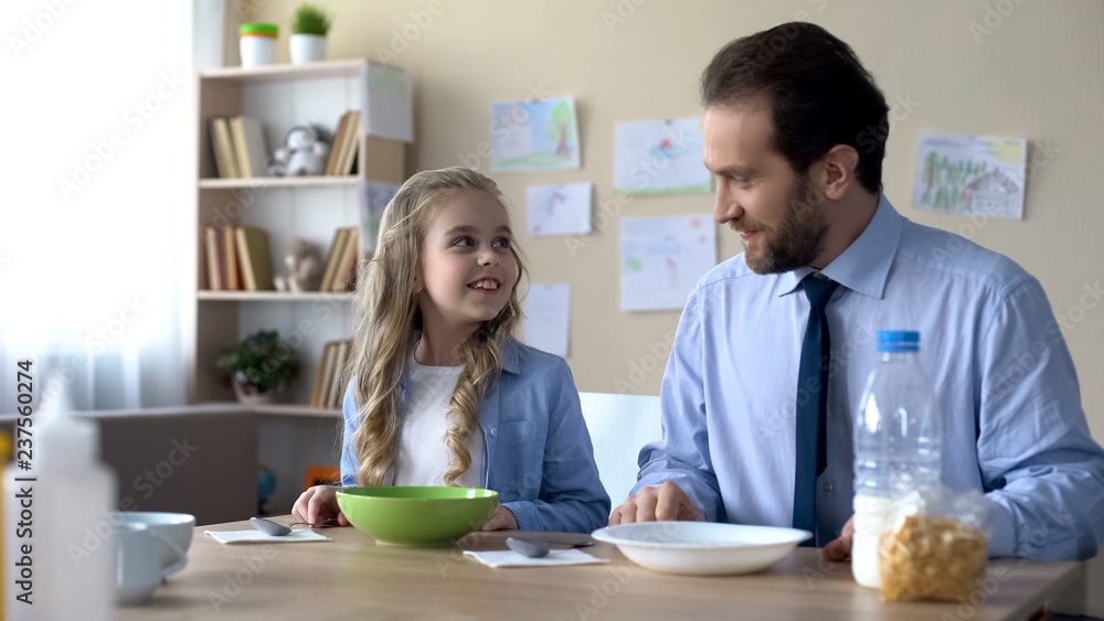 Cheerful father and daughter going to have healthy breakfast, energy source Cheerful father and daughter going to have healthy breakfast, energy source