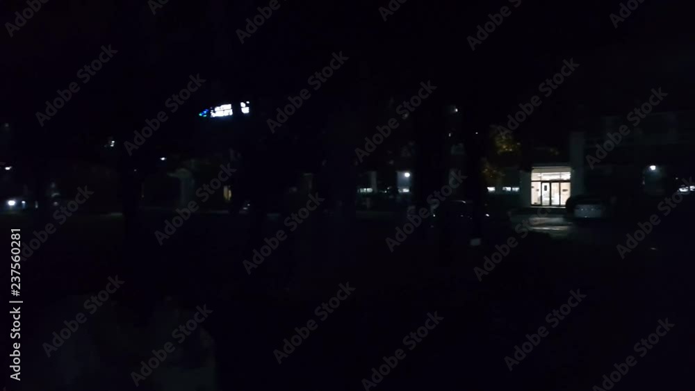 4K view of Night illuminated cityscape view. Lights in buildings at night. City at night in urban area of a developed country 4K view of Night illuminated cityscape view. Lights in buildings at night. City at night in urban area of a developed country