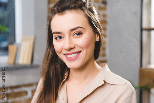 portrait of beautiful young businesswoman smiling at camera