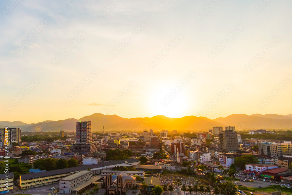 Aerial View of Ipoh ,Malaysia during sunset. soft focus,blur due to long exposure. visible noise due to high ISO.