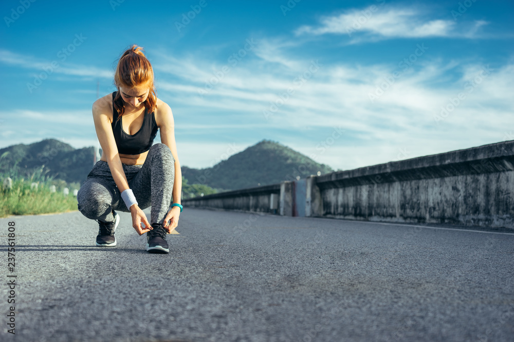 Asian woman is workout and running at the morning, she is warm up her body and drinking water. Healty and sport lifestyle concept. Asian woman is workout and running at the morning, she is warm up her body and drinking water. Healty and sport lifestyle concept.