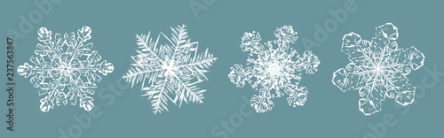 Set of white fluffy snowflakes on blue background. winter decoration