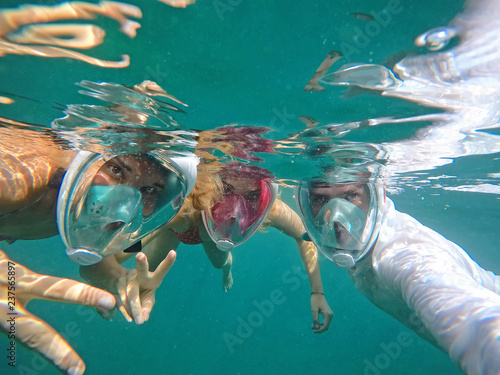 Friends snorkeling in the ocean  photo