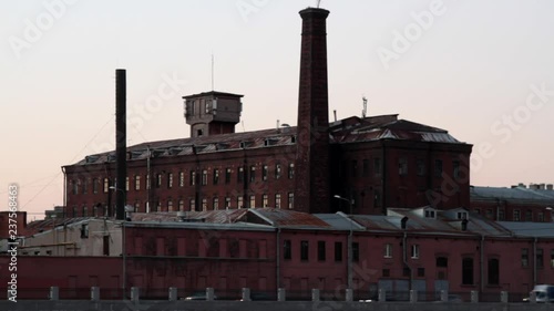 Bicentennial old factory m brick pipe and modern highway in front of
 photo