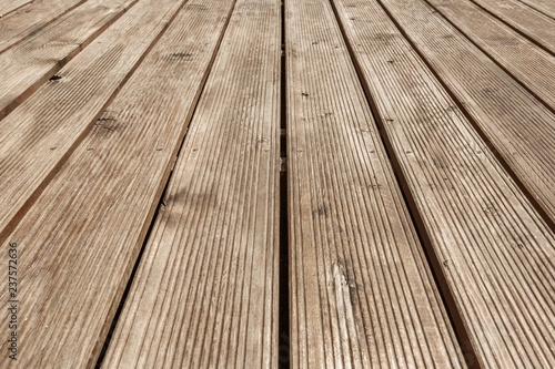Brown plank wooden floor texture perspective background, top view, copy space