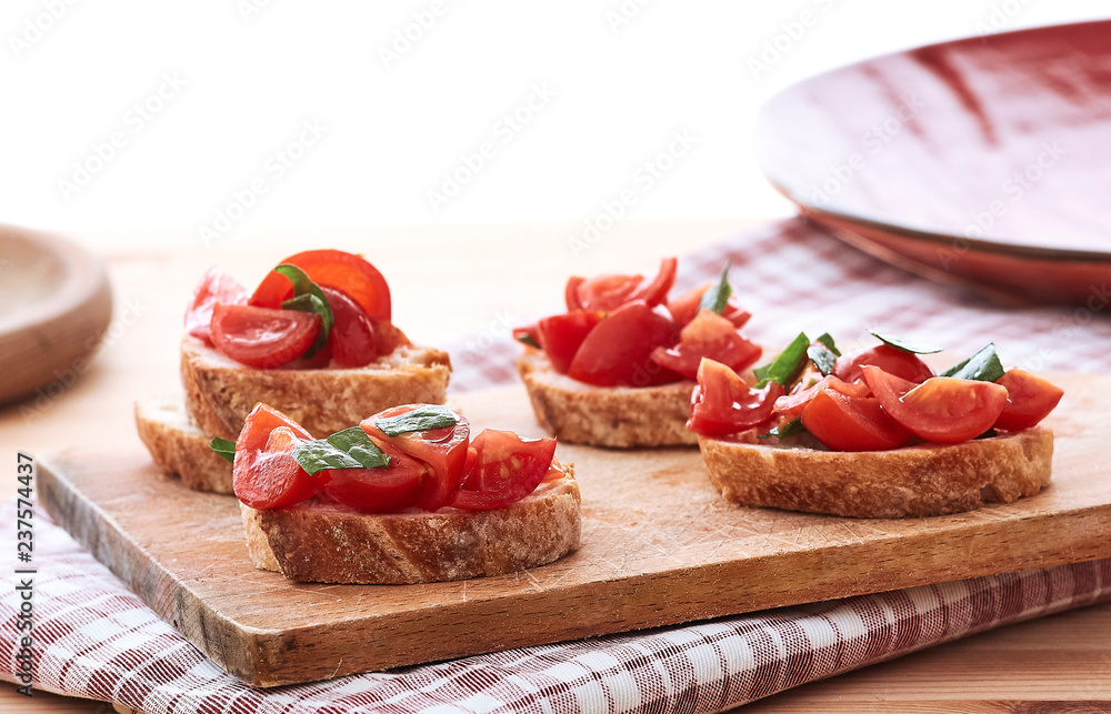 tomato bruschetta with basil on wood board tomato bruschetta with basil on wood board
