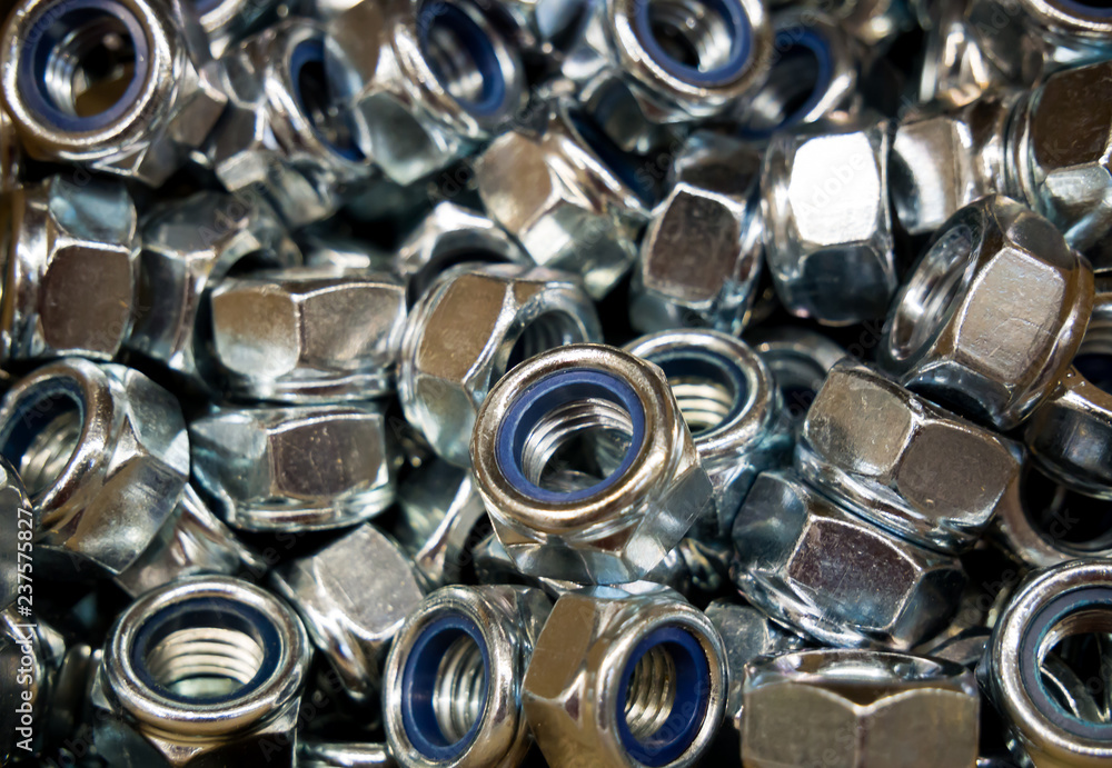 Background of a variety of metal self-locking nuts Background of a variety of metal self-locking nuts
