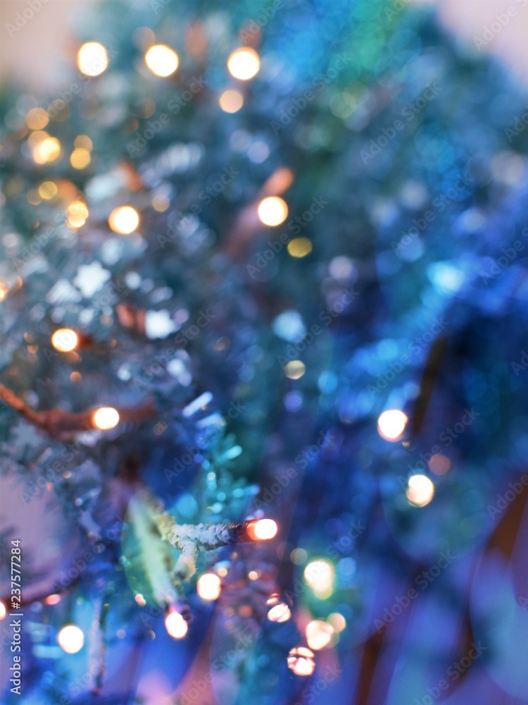 Festive texture in delicate turquoise and purple hues with colorful beautiful bokeh and multi-colored spots Festive texture in delicate turquoise and purple hues with colorful beautiful bokeh and multi-colored spots