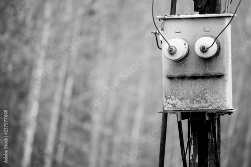 The black and white photo of the electric box similar to face of the old robot