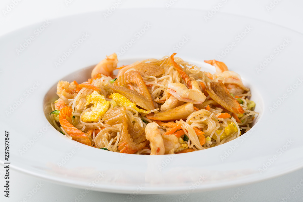 Plate of asian food with noodles and seafood