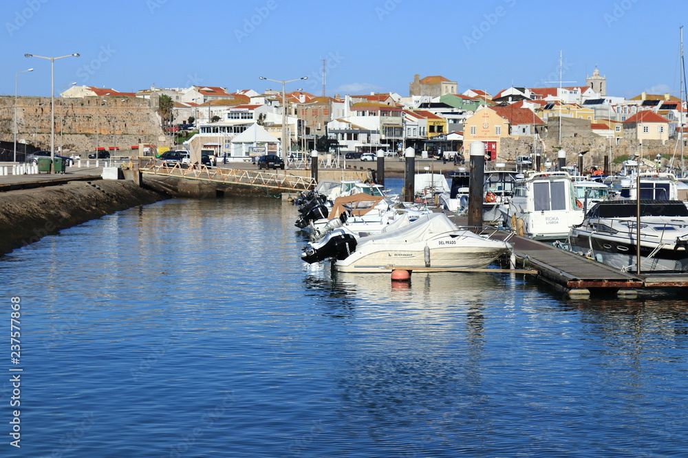 Peniche marina with blue water in the foreground and boats in the background