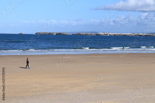 Couple strolling on the beach sand