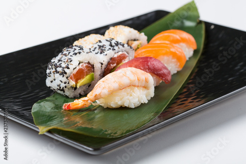 Assorted sashimi with three sushi rolls