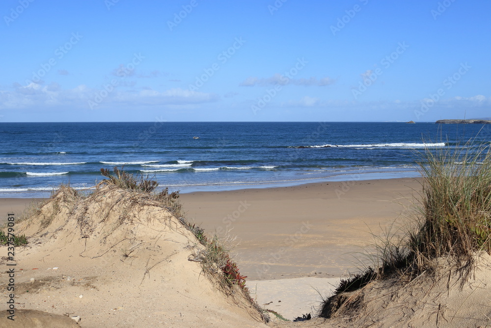 view over the dunes to the blue waters beach, Gâmboa beach