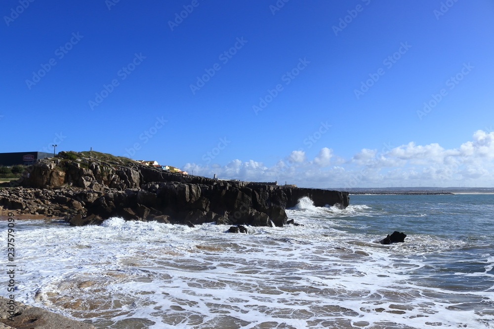 water to hit violently on the rocks creating white foam