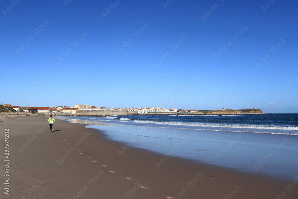 woman jogging in the sand on the beach woman jogging in the sand on the beach