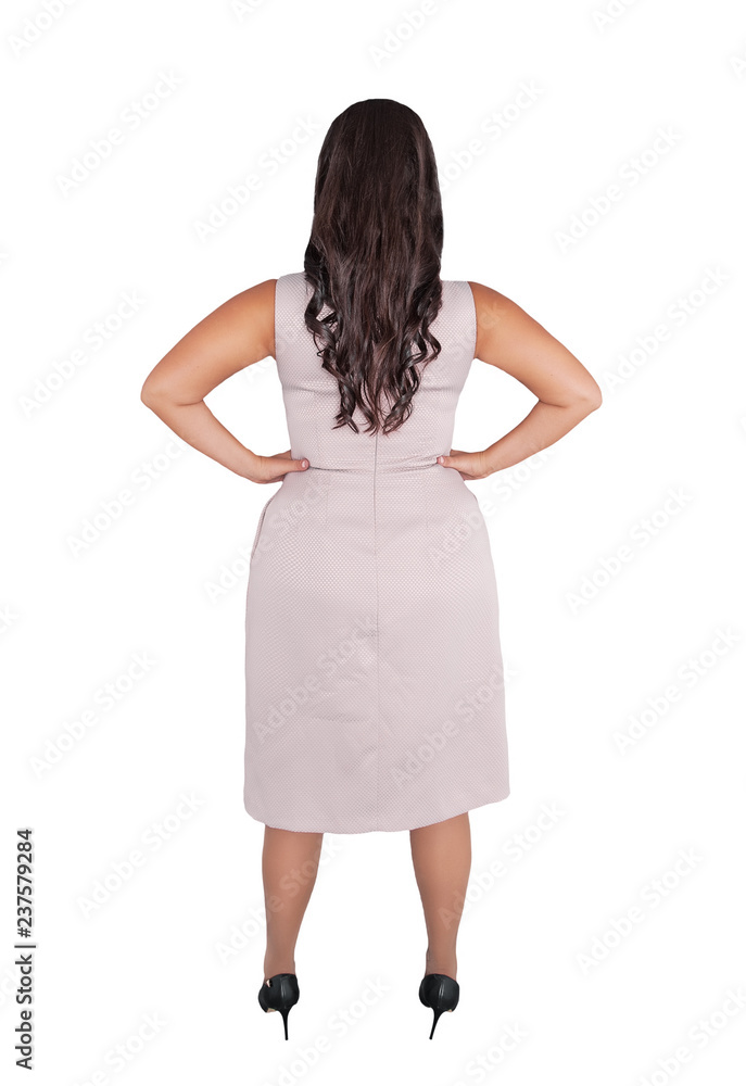 Beautiful plus size woman in pink dress isolated. Back pose Beautiful plus size woman in pink dress isolated. Back pose