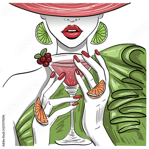 woman with citrus martini cocktail in hat
