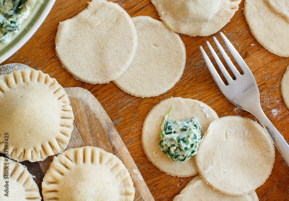 Making ravioli with ricotta cheese and spinach Making ravioli with ricotta cheese and spinach