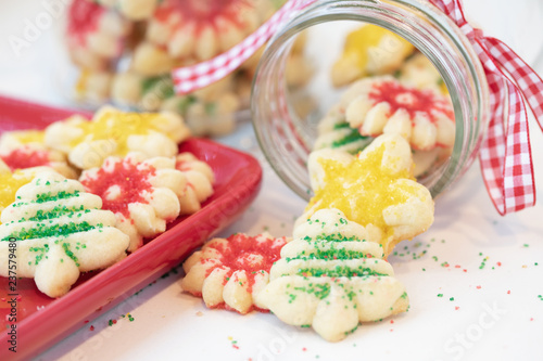 Christmas photograph of homemade Spritz cookies flowing out of a Mason jar