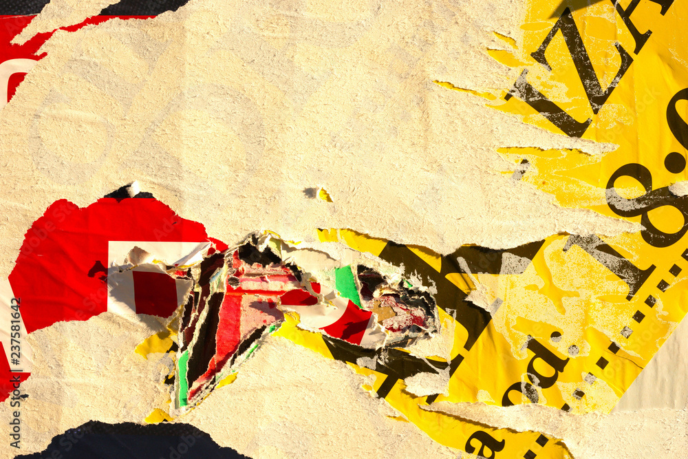 Fototapeta premium Old grunge ripped torn vintage collage street posters creased crumpled paper surface placard texture background backdrop empty space for text