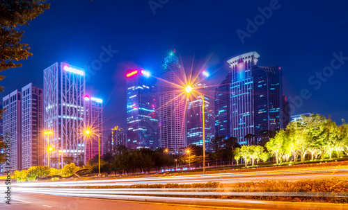 In the evening  there are blurred traffic lights on Chinese roads...