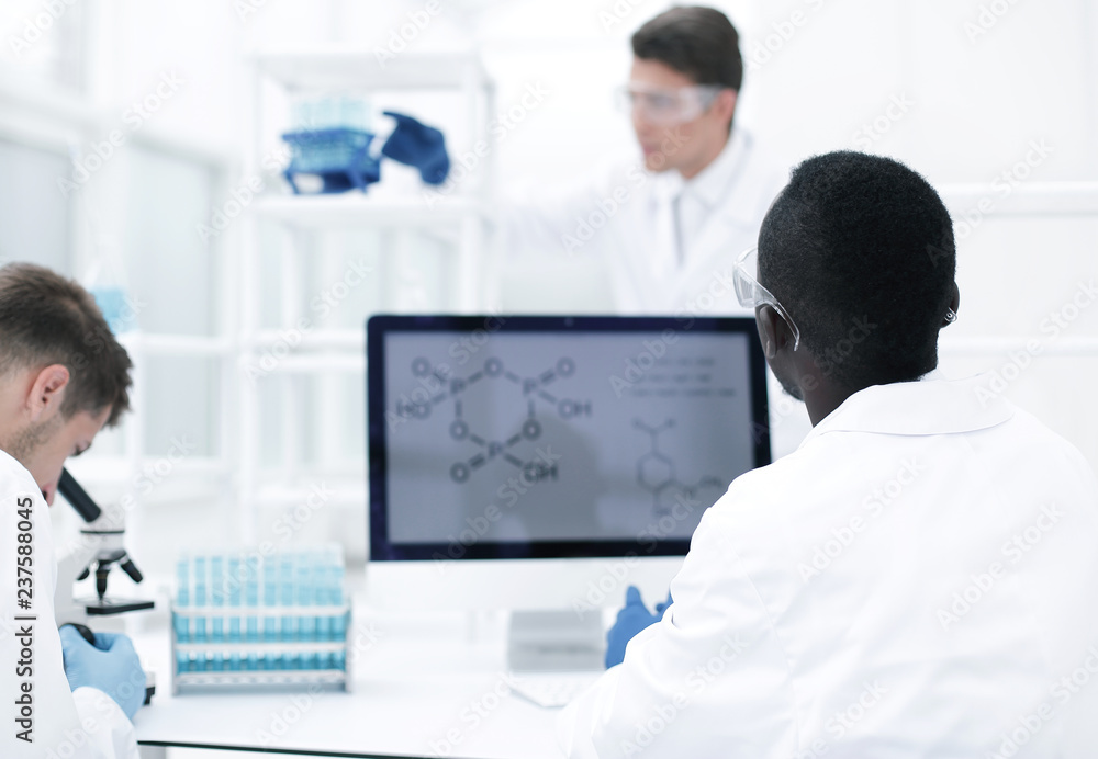 group of scientists working in the laboratory group of scientists working in the laboratory