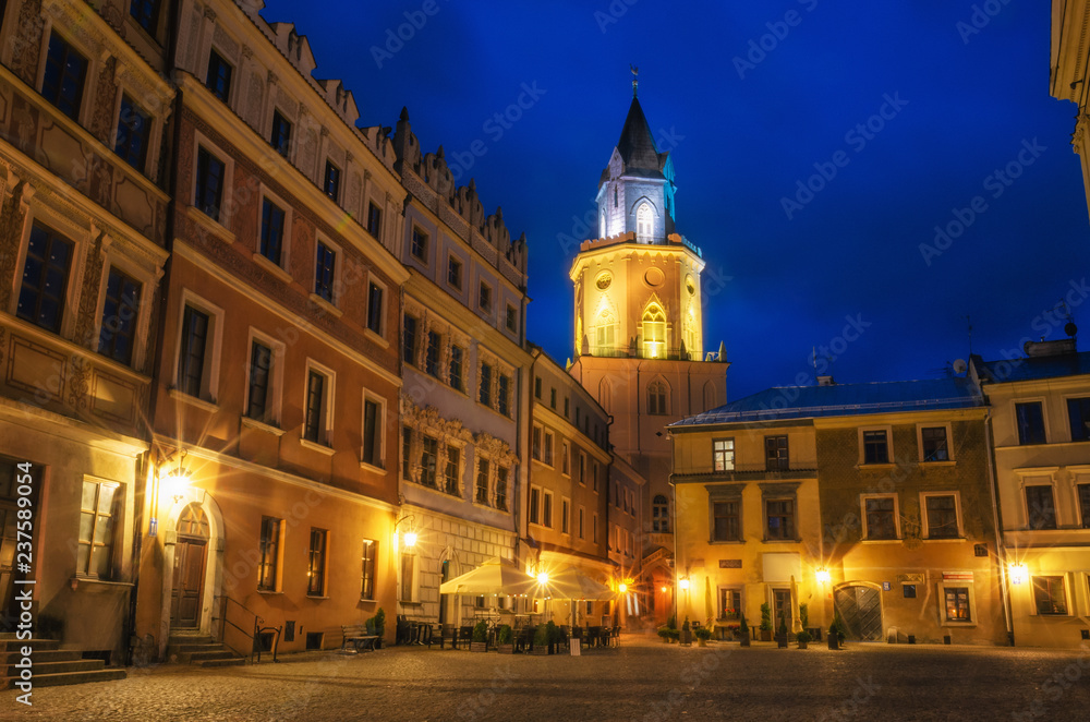 Market with The Archdiocesan Museum of Religious Art in The Trinitary Tower in Lublin old town at night, Poland