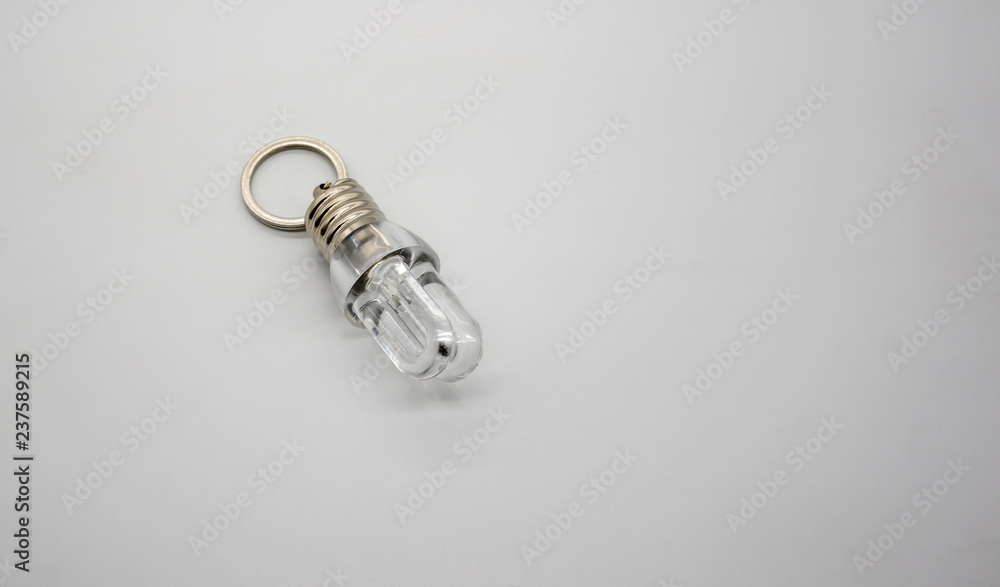 LED flashlight mini bulb with U shape keychain isolate on white LED flashlight mini bulb with U shape keychain isolate on white