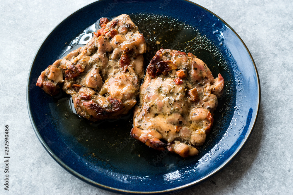 Juicy Chicken Thighs with Sauce of Thyme, Onion and Dried Tomatoes. Juicy Chicken Thighs with Sauce of Thyme, Onion and Dried Tomatoes.