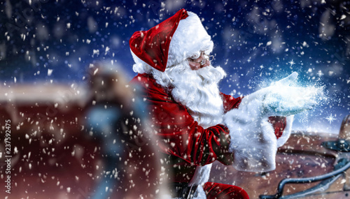 Red old Santa Claus and magic night with snowflakes  © magdal3na