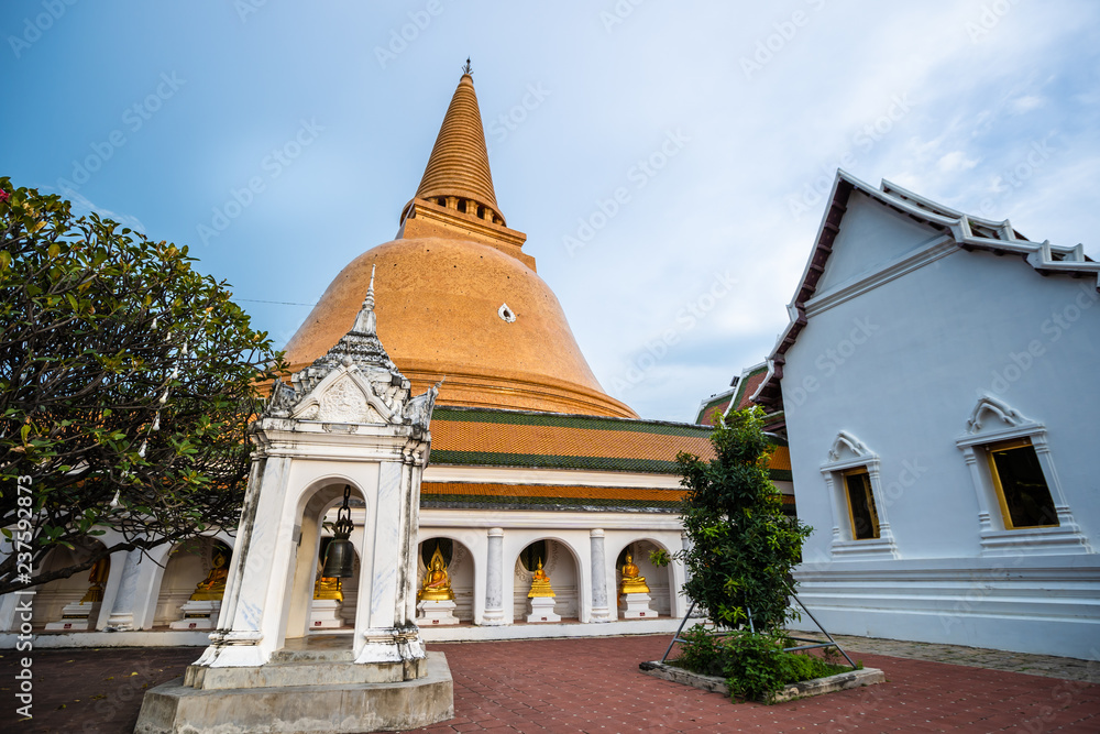 Wat Phra Pathom Chedi in blue sky, Thailand. Golden stupas.