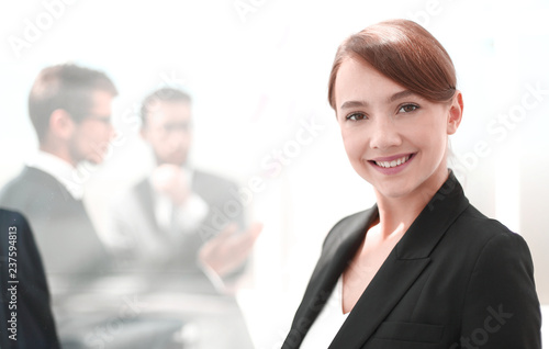 portrait of a young business woman on the background of the office