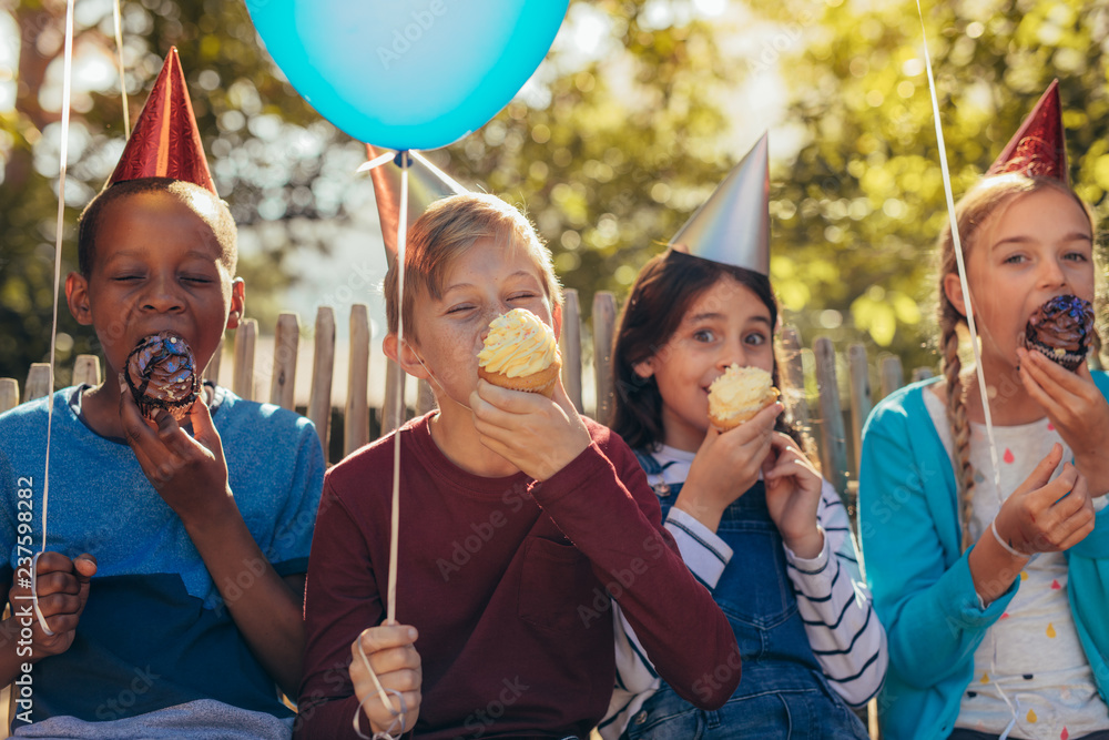 © Jacob Lund - Group of kids having a party