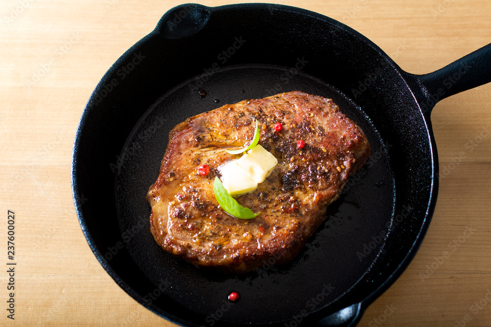 Food concept grilled Marinat Sirloin meat steak in Cast-Iron Skillet pan with copy space