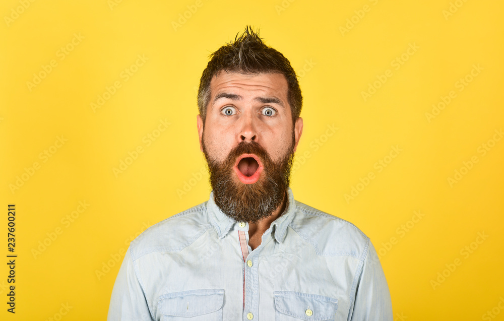 Surprised bearded man in casual clothes. Fashion model with stylish hair. Astonished man with long beard&mustache. Hipster in white shirt. Barber fashion and beauty. Fashionable bearded male. Portrait Surprised bearded man in casual clothes. Fashion model with stylish hair. Astonished man with long beard&mustache. Hipster in white shirt. Barber fashion and beauty. Fashionable bearded male. Portrait