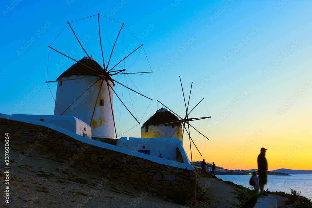 Windmills on the seashore in Mykonos at sundown