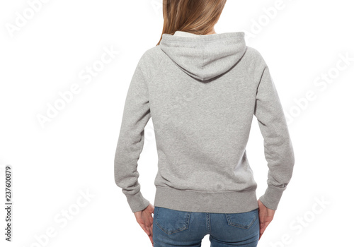 young girl in gray sweatshirt, gray hoodies back view. white background