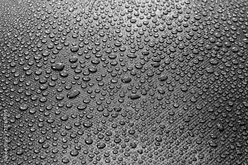 Water drops on dark textured background