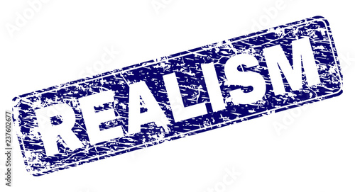 REALISM stamp seal print with grunge style. Seal shape is a rounded rectangle with frame. Blue vector rubber print of REALISM title with unclean texture.