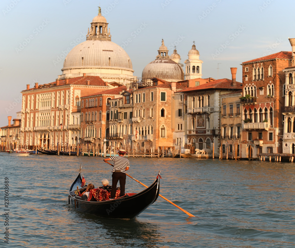 Italy beauty, gondola with cathedral Santa Maria della Salute in Venice, Venezia