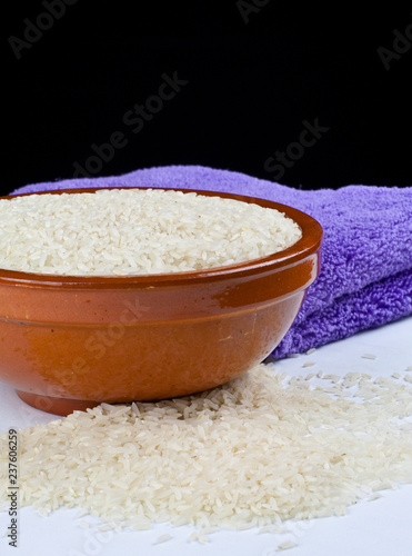Bowl of rice and kitchen towel detail