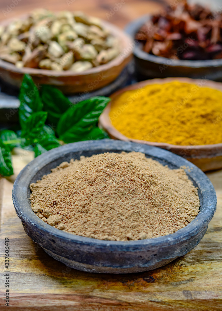 Amchoor or aamchur, mango powder, fruity spice powder made from dried unripe green mangoes in India, used to flavor foods close up Amchoor or aamchur, mango powder, fruity spice powder made from dried unripe green mangoes in India, used to flavor foods close up