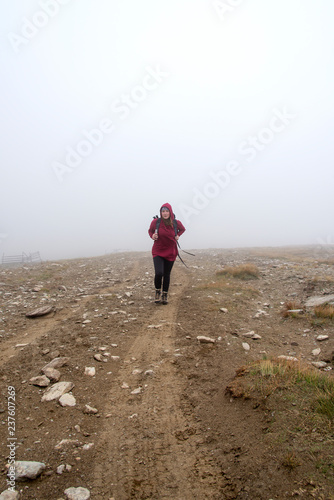 Woman in the fog on the mountain