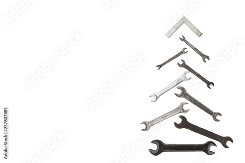 christmas tree figure made of old rusty wrench isolated on white