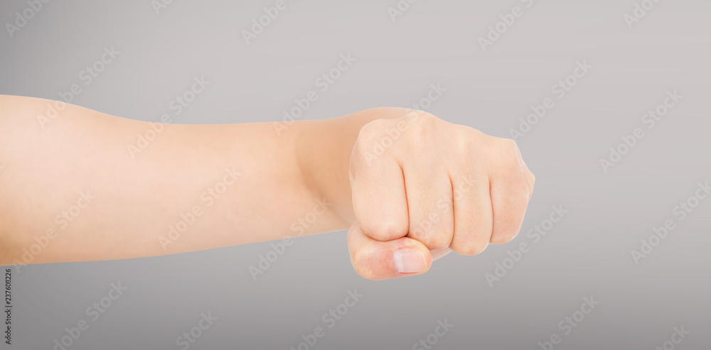 Woman fist isolated on a grey background. Front view.