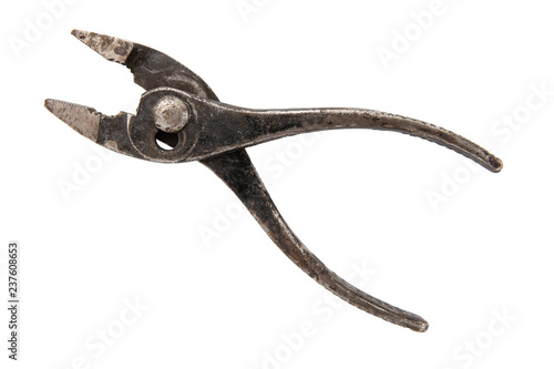 Old rusty vintage pliers isolated on white background side view