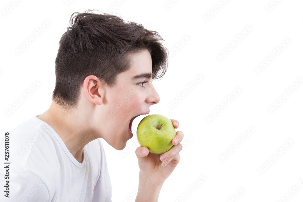 portrait of young eating and biting the apple portrait of young eating and biting the apple
